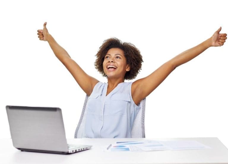 Woman Smiling With Excitement At Desk